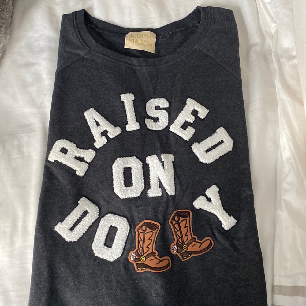 Judith March raised on dolly shirt